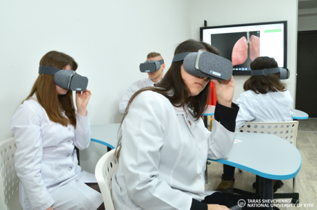 A photograph of students involved with virtual education at the Taras Shevchenko National University of Kyiv.