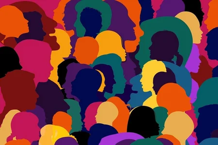 Colorful and abstract illustration featuring numerous overlapping silhouettes of human profiles in various colors, representing diversity of humanity.