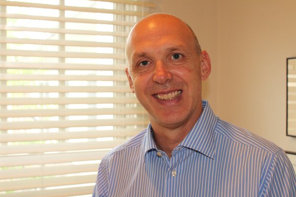 A portrait photo of Dr. Graham Harrison, Managing Director of EUniWell.