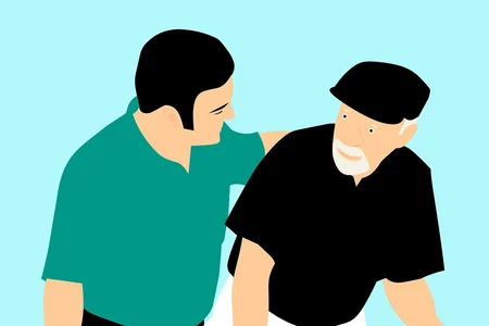 A young man placing a hand on the shoulder of an old man showing him support and assistance.