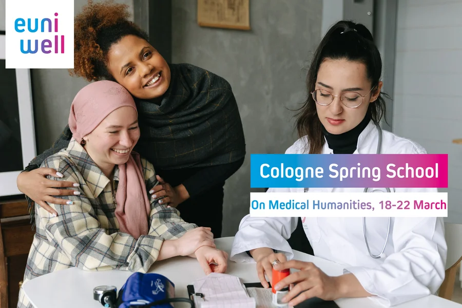 A person with a headscarf is hugged from a smiling person and a person in a white code is looking at documents. In the upper left corner is the EUniWell logo and there is a textbox with the text "Cologne Spring School - "On Medical Humanities, 18-22 March". 