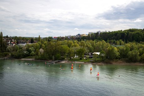 A photograph of Lake Constance and the university in the background.