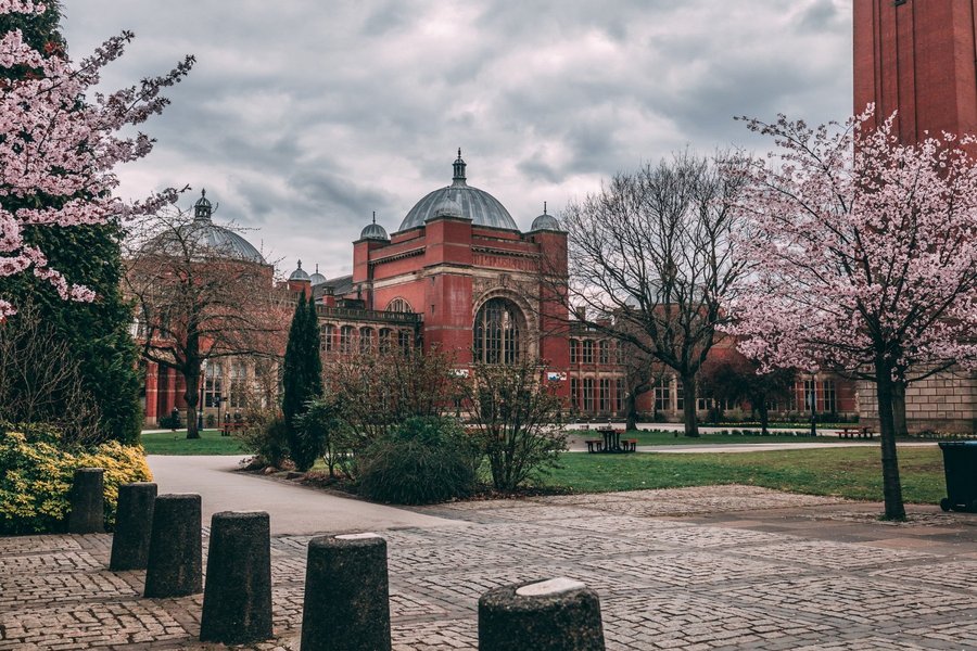 A building with a park at the University of Birmingham.