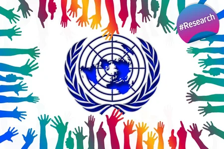 The United Nations logo in the center, surrounded by colorful, outstretched hands reaching towards it from all sides, symbolising global unity and cooperation. There is a #Research badge on the top right corner.